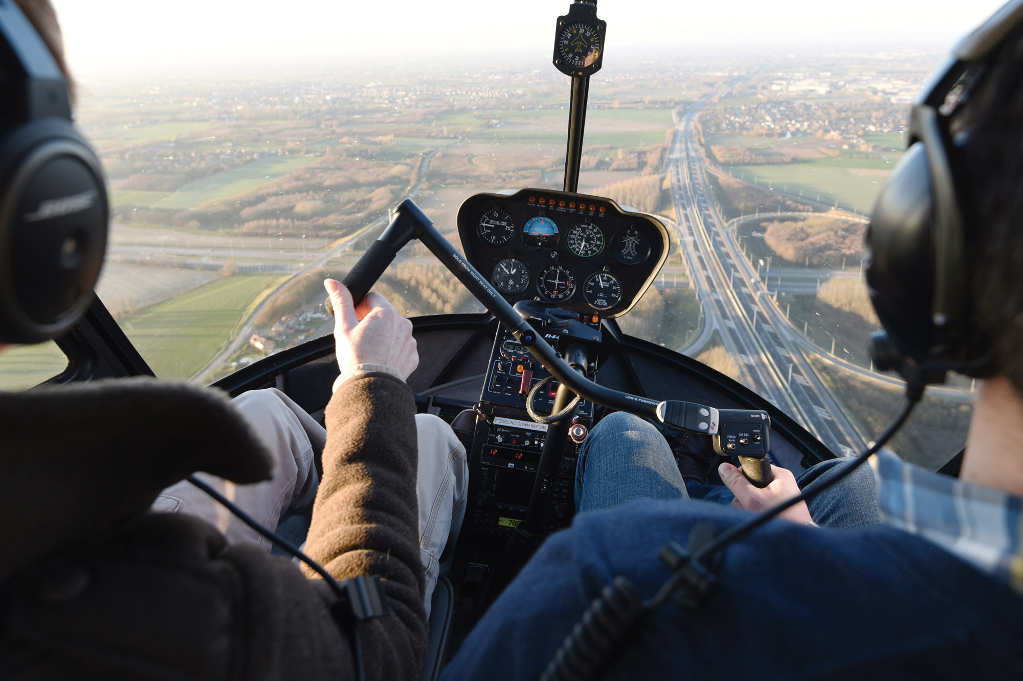 student helicopter pilot with instructor